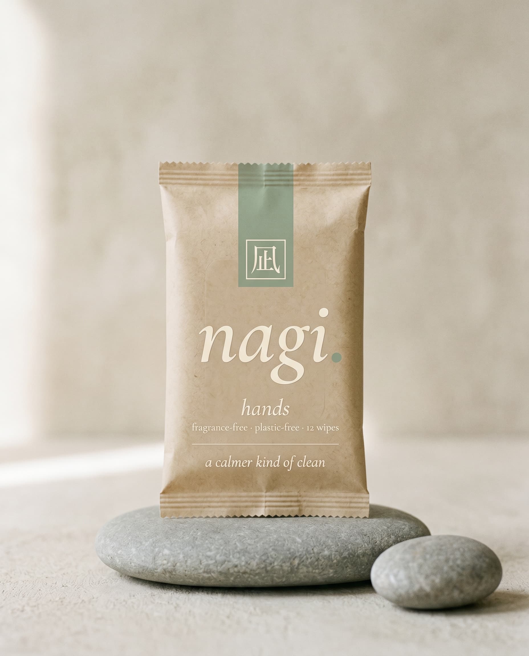 nagi hands — 100% cotton wipes on a smooth river stone