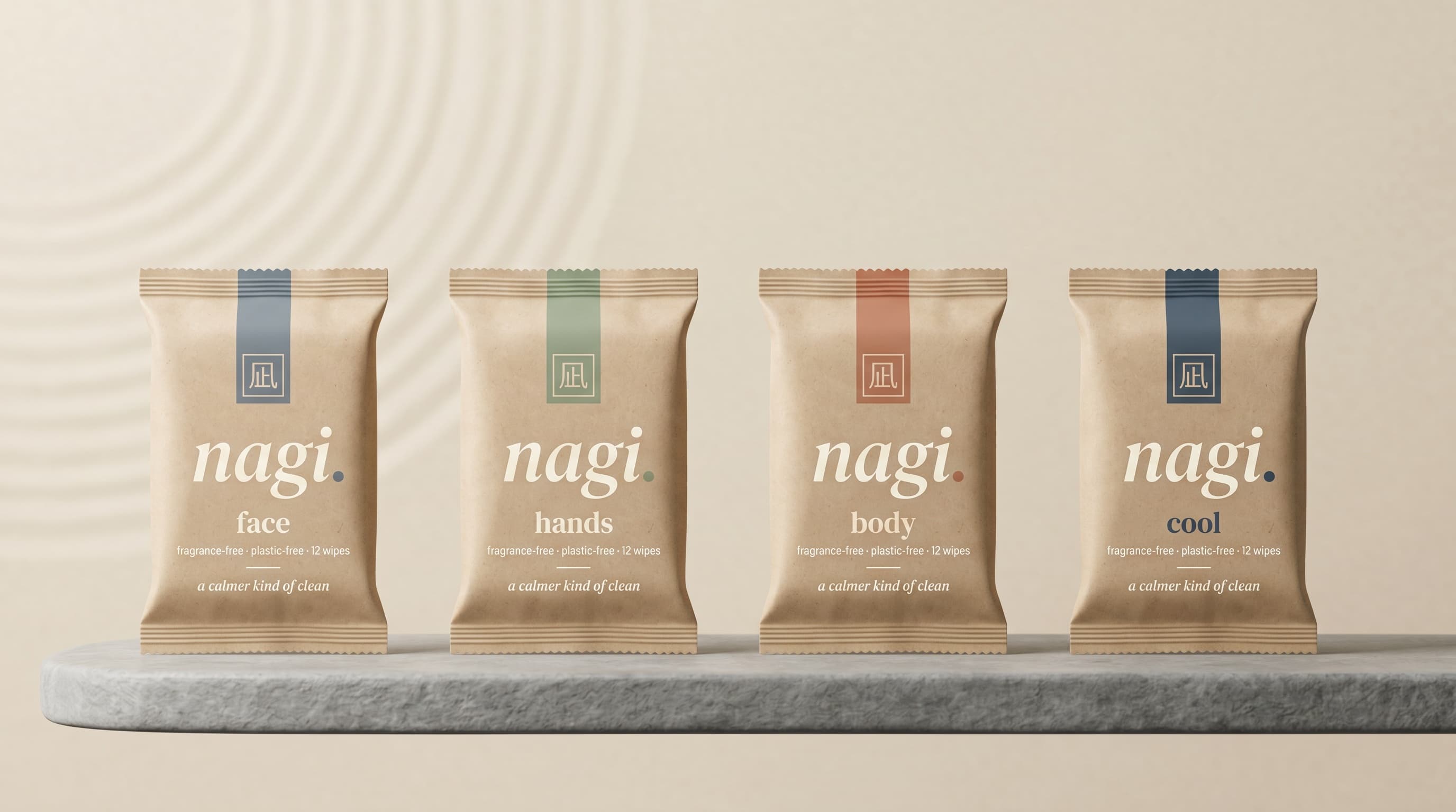 The four nagi wipes lined up on a stone shelf — face, hands, body, cool